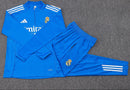 CONJUNTO SUDADERA + PANTS REAL MADRID ENTRENAMIENTO AZUL BLANCO 25/26 HOMBRE MEDIO CIERRE